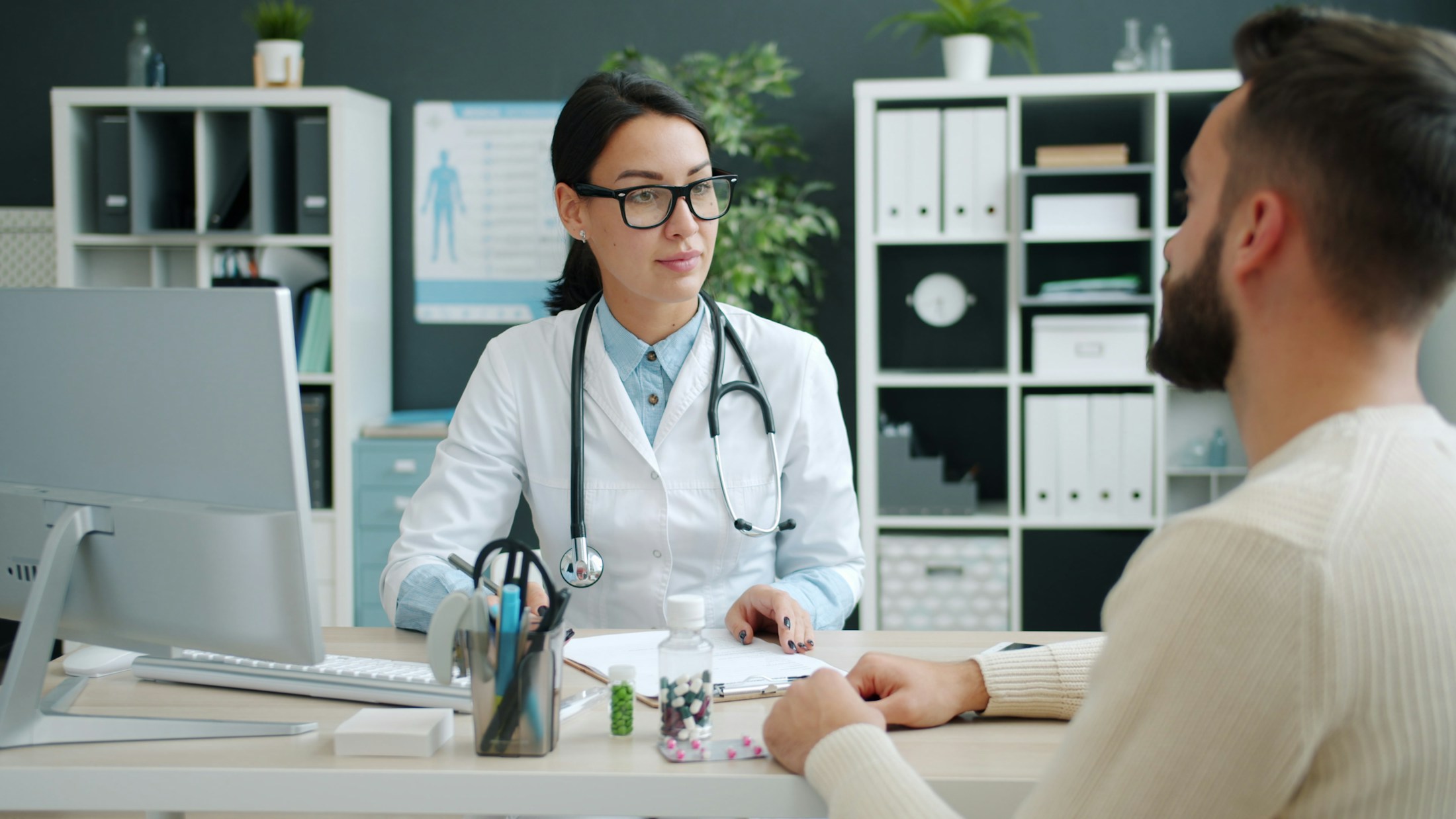 A doctor discussing care with a patient in a medical office